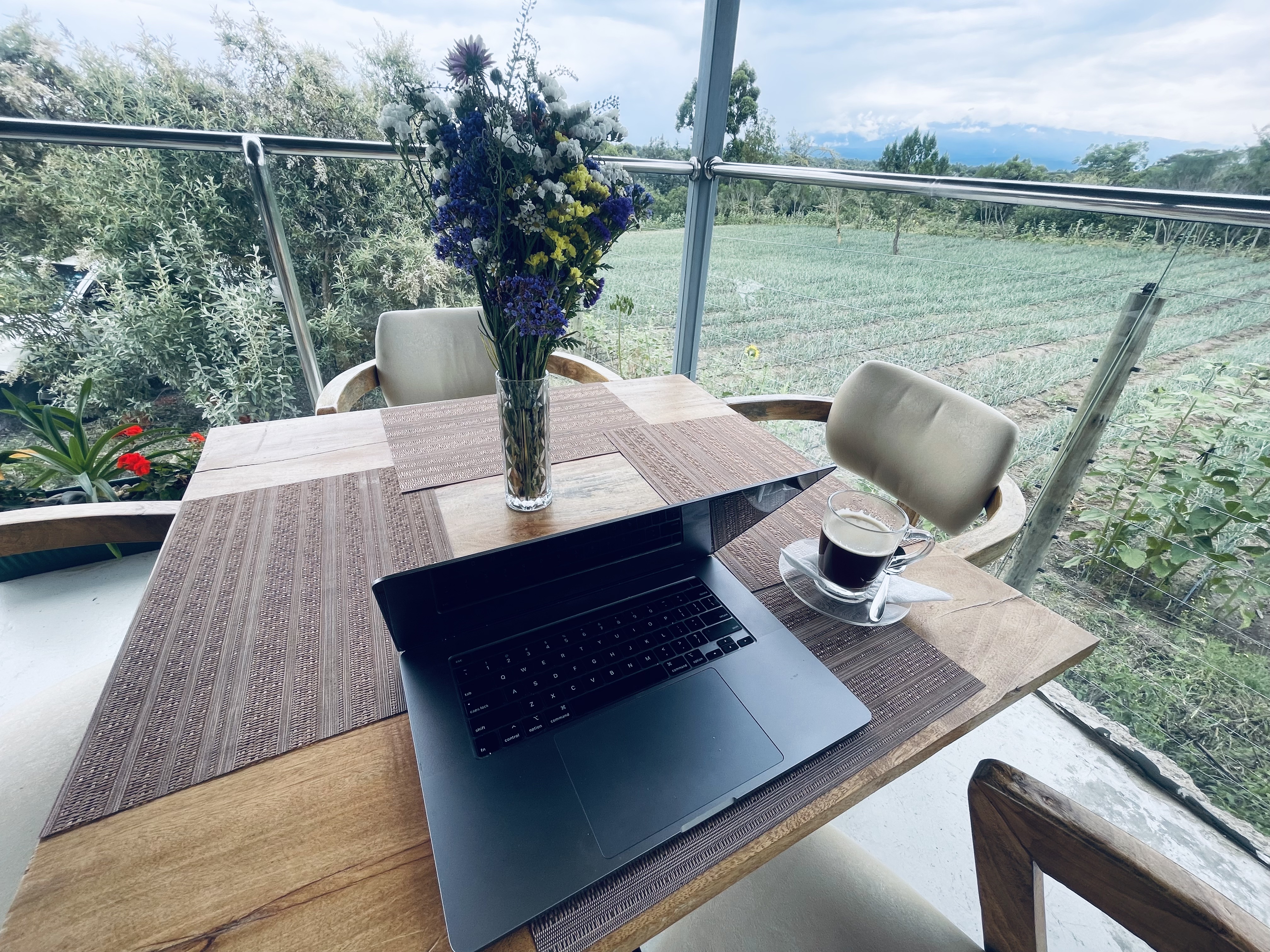 Workation at Idan Barn Suites — laptop, coffee, Mt. Kenya view